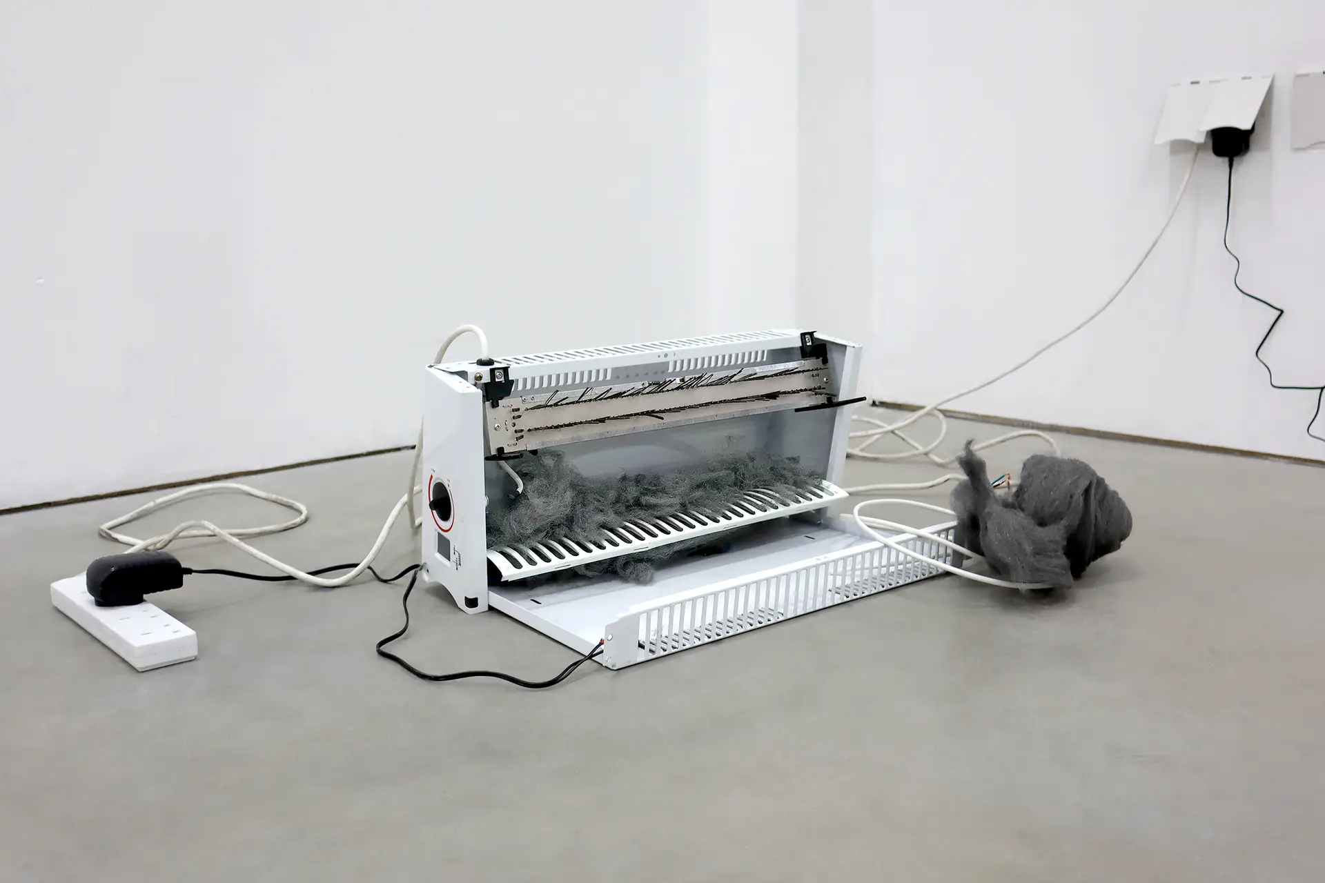 Woojin Jeon, ON / ON, 2024 Broken heater, steel wool, electrical cable 12v dc power supply with illumination, variable installation